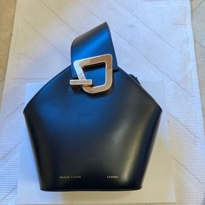 DanseLente small black pocketbook. Box and bag for pocketbook included.